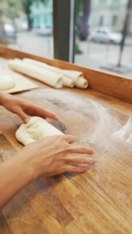 baker kneading dough