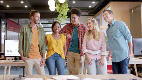 Portrait-of-happy-diverse-business-people-in-office-in-slow-motion