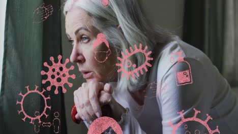 animación de iconos de virus sobre una mujer caucásica mayor en la cama