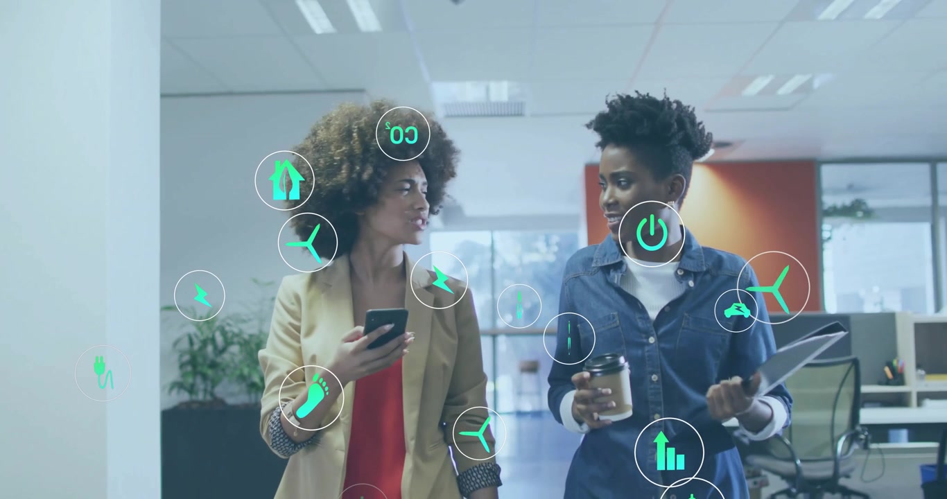 Women walking office, gesturing to smartphone and activating animated energy icons for data review