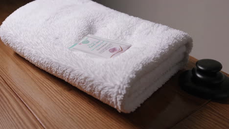 spa facial treatment with mask and stones