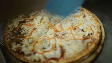 chef baker cook pizza. closeup hand of chef baker making pizza at kitchen