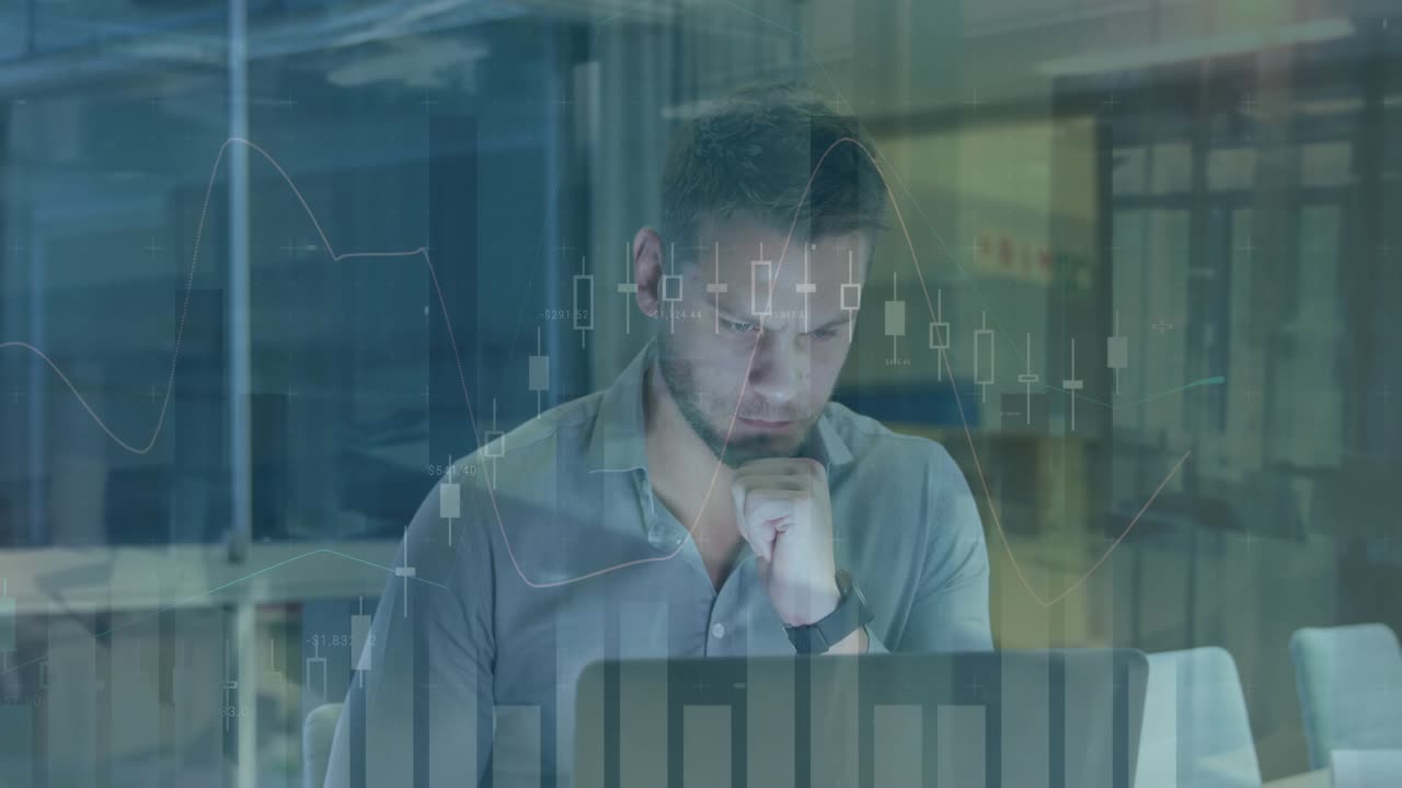 Office worker powering laptop and analyzing financial chart overlay for market insights
