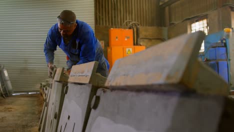 worker making mold in foundry workshop 4k