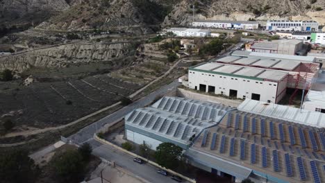 aerial view of industrial building with rooftop solar panels