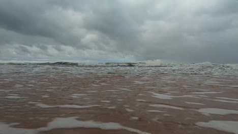 sea waves propel the foam to the shore