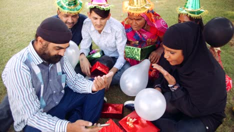 adults celebrating party outdoors colourful