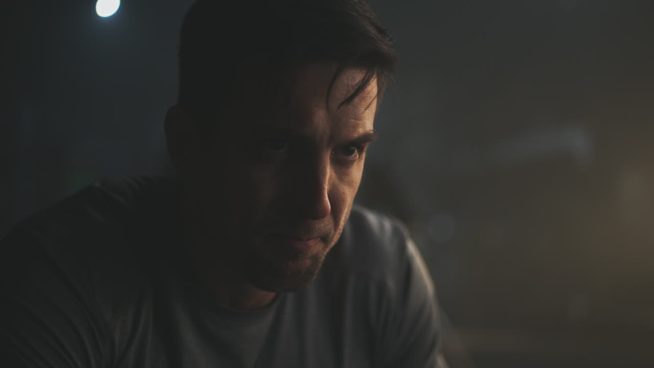 Focused Man in a Dark Room