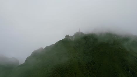 aerial landscape of green mountain in sapa vietnam as clouds and fog cover the peek lao cai vietnam
