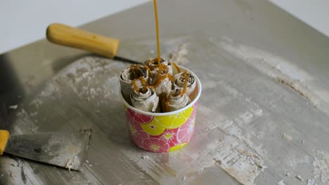 caramel rolled ice cream in a cup