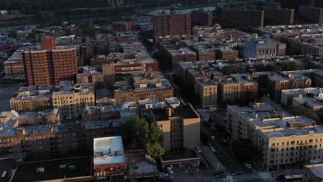 Aerial-trucking-shot-across-the-Inwood-neighborhood-of-Upper-Manhattan-at-Golden-Hour