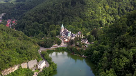 revealing drone shot of lillafured palace in hungary