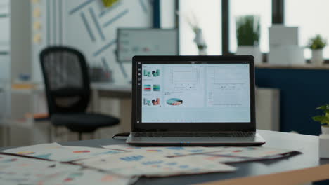 Closeup-of-laptop-screen-with-enterprise-resource-planning-showing-moving-charts-and-growing-turnover