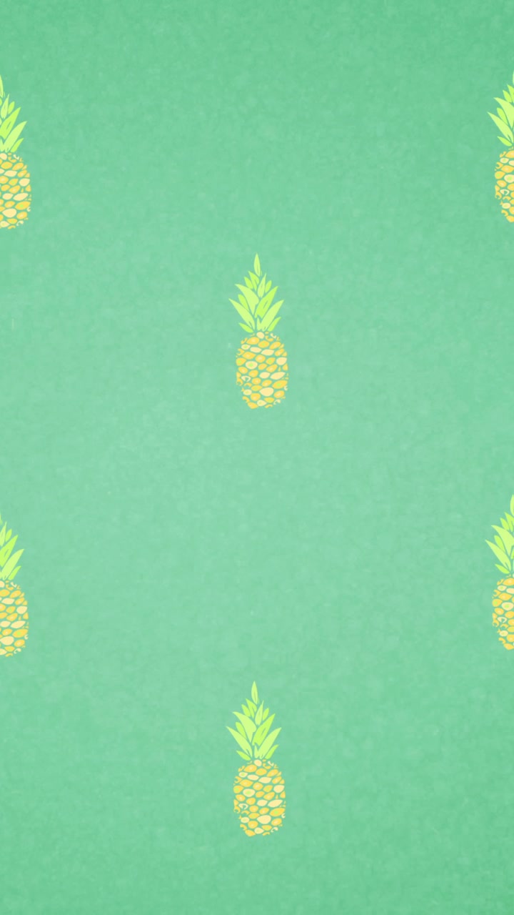 Animation of single pineapples floating on green background