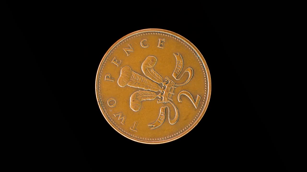 United Kingdom 2004 two pence coin reverse with Prince of Wales badge rotating on black background