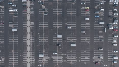 aerial: very high flight over almost empty parking space lot