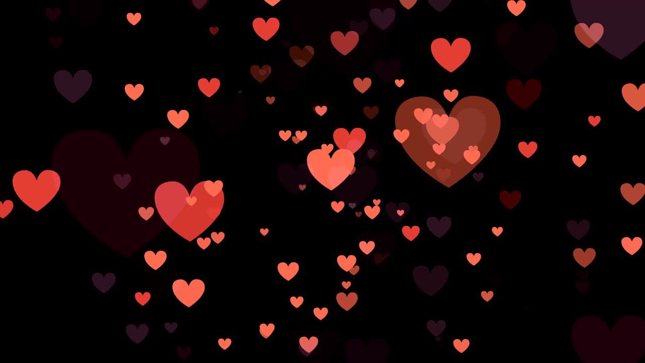 검은 바탕에 빨간색과 분홍색의 심장이 있습니다.