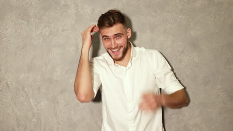 attractive bearded stylish young man looking at camera