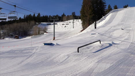 X-Games-Half-Pipe-ski-snowboarding-terrain-park-rail-fresh-groomed-bluebird-sunny-morning-bottom-of-Buttermilk-opening-chairlifts-going-up-Aspen-Colorado-slider-movement-left
