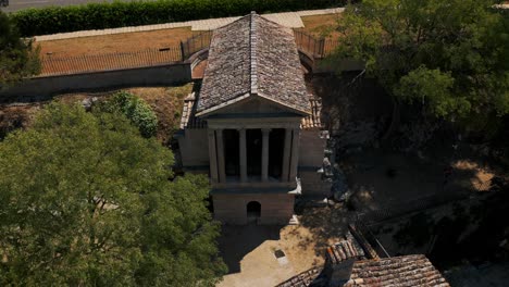 aerial rising above temple of clitumnus in pissignano historical italian town