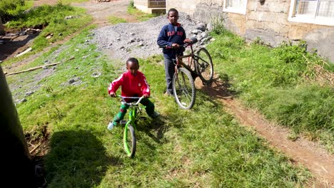 africa children playing with the bicycle after school close up during holiday. children playing during holiday