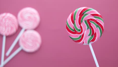 top view of pink color candy on color background