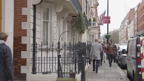 People-Walking-Past-Office-Buildings-In-Grosvenor-Street-Mayfair-London-1