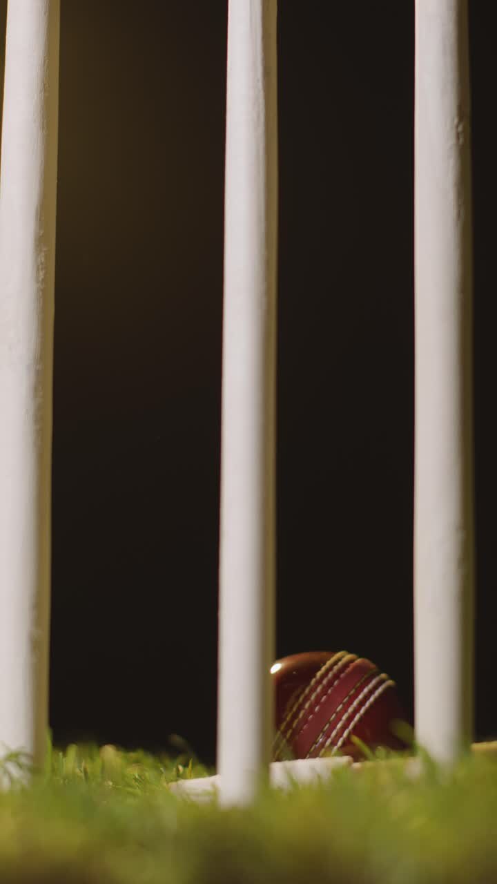 Vertical Video Cricket Still Life With Close Up Of Ball Hitting Stumps Bowling Out Batsman 1