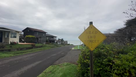 Vintage-Dead-End-Signage-Over-Quiet-Coastal-Village