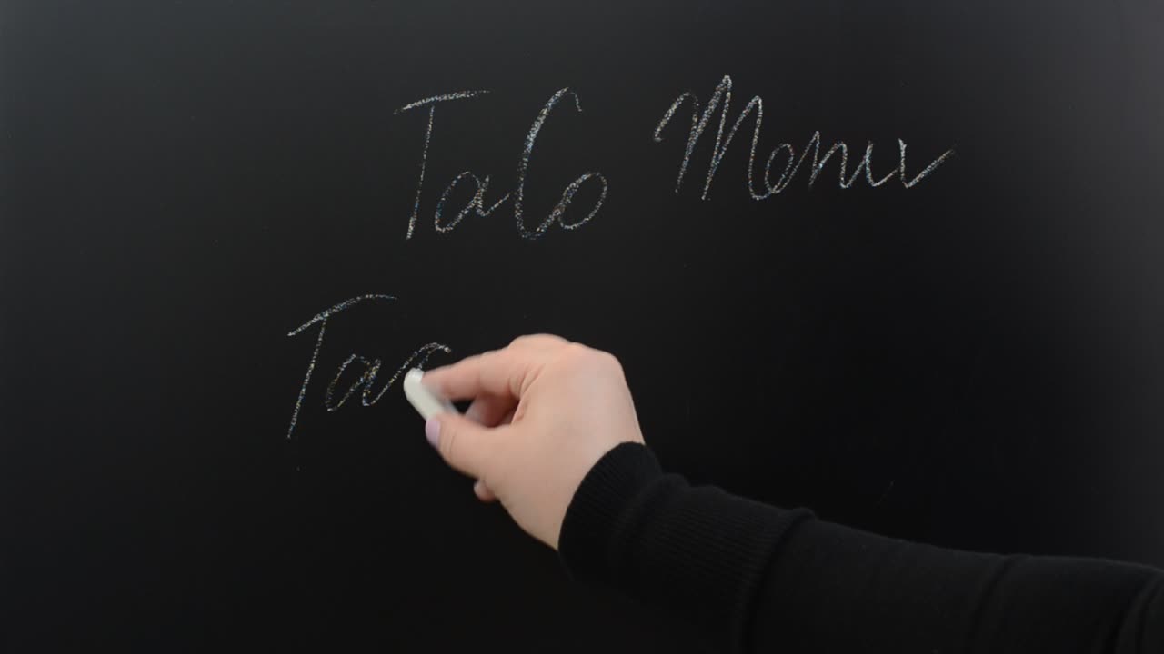 We write on a menu board. Inscription chalk on a board