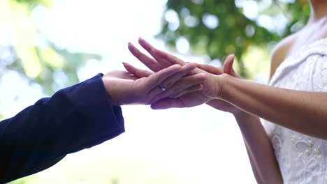 Wedding,-marriage-and-hands-of-couple-in-park