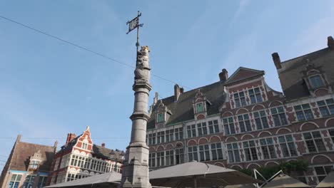 charming square in ghent featuring historic flemish architecture and blue skies