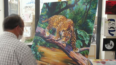 artist timelapse painting jaguar in art gallery