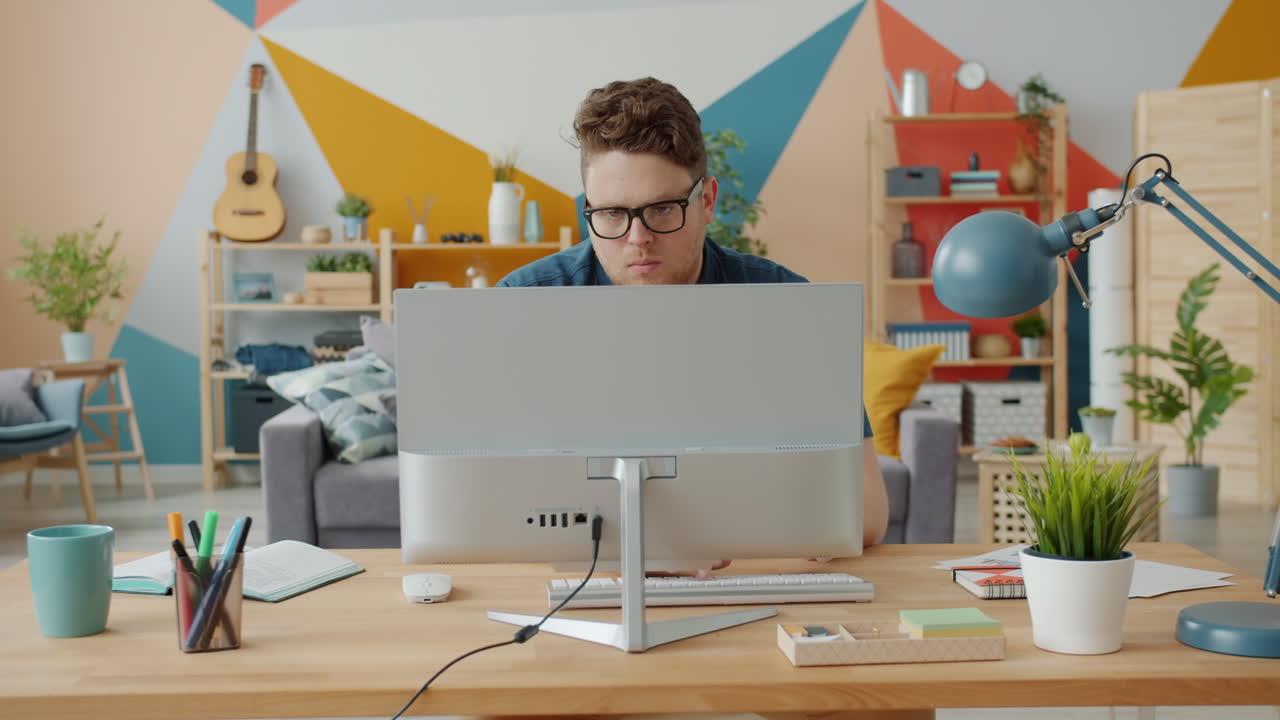 Man Working at Home on Computer