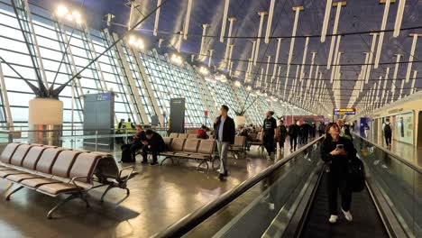 travelers moving through shanghai airport terminal