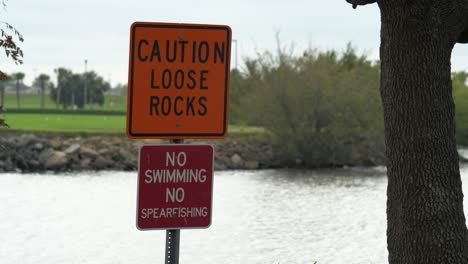 caution loose rocks no fishing spearfishing sign lake pontchartrain