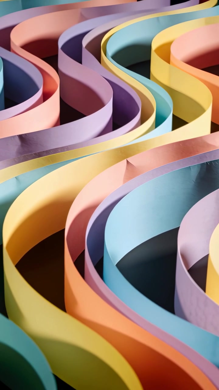 Vertical video: Panning shot showing S-curve pastel paper strips on dark base, revealing rhythm