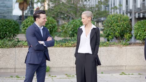 business professionals conversing outdoors