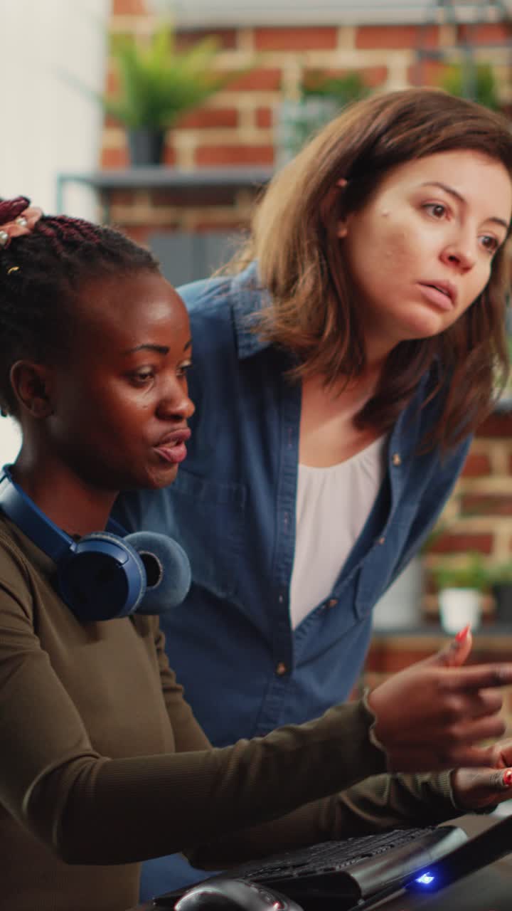 Vertical video: Diverse team of women brainstorming ideas to plan 3d project