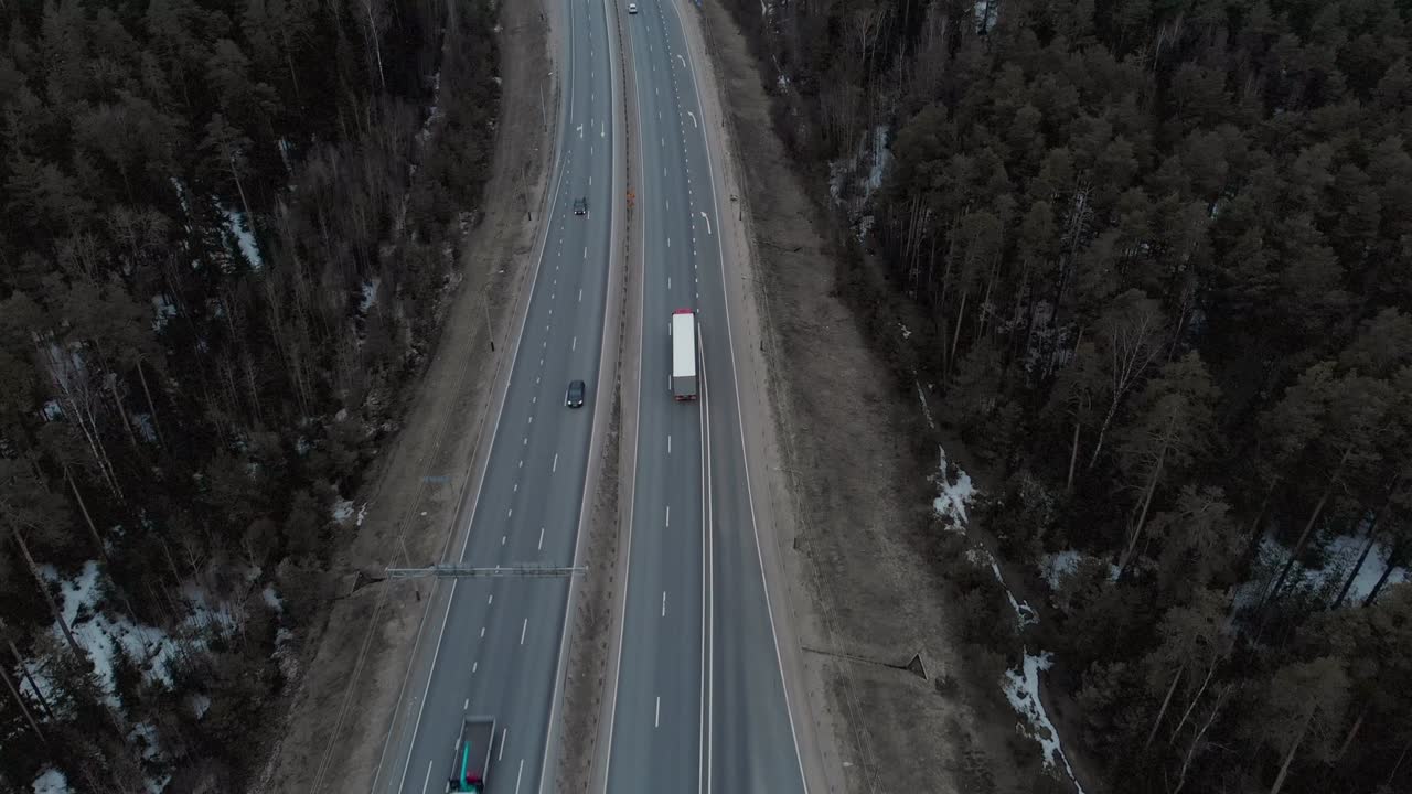A car interchange with an overpass on a cloudy spring evening in the woods