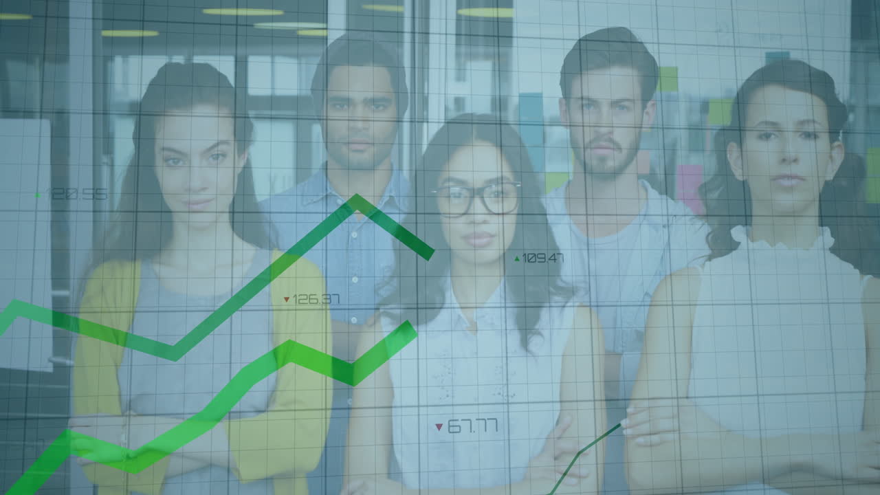 Business team in office with financial graph animation overlaying their image