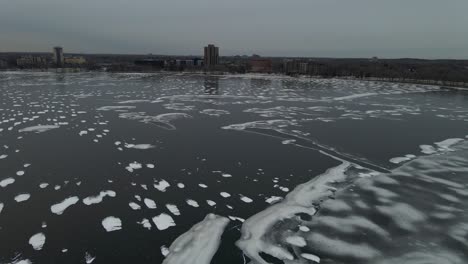 aerial view of lake bde maka ska in minneapolis during winter with the surface completely frozen