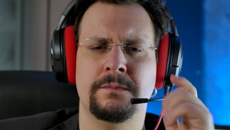 close up of a concentrated call center operator wearing a headset