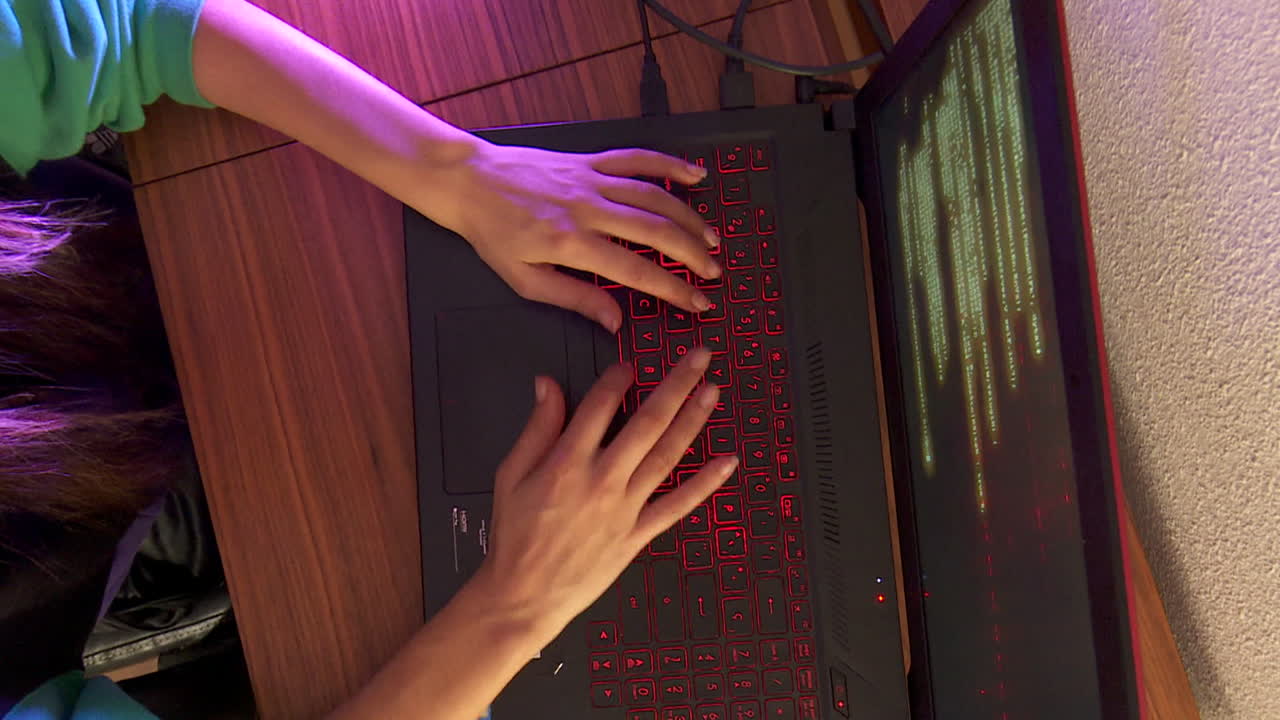 Person Coding on Laptop