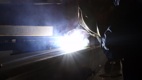 a man at work welding beams together