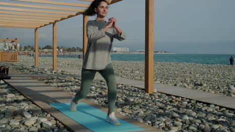 woman exercising on a beach