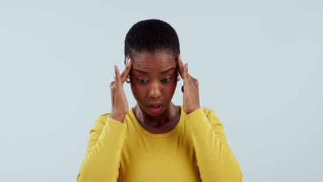 Black-woman,-headache-and-pain-in-studio