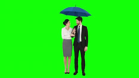 business people standing under umbrella