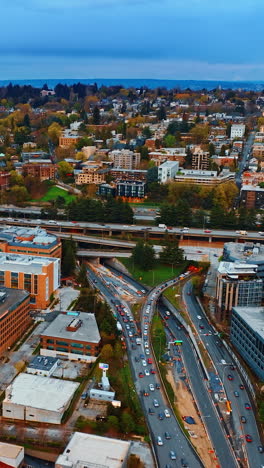 sunny washington state city buildings. seattle american city aerial view. vertical video