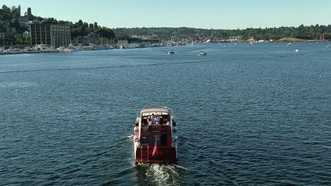 Aerial-view-of-a-yacht-sailing-through-South-Lake-Union-in-Seattle